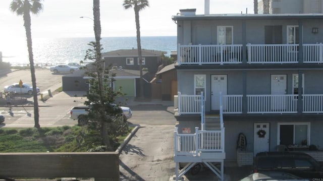 view of building exterior with a water view