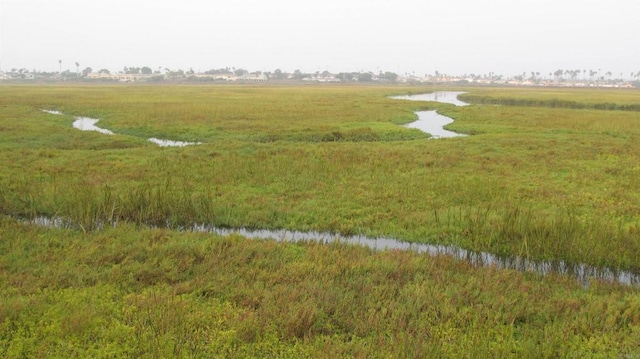 aerial view with a water view and a rural view