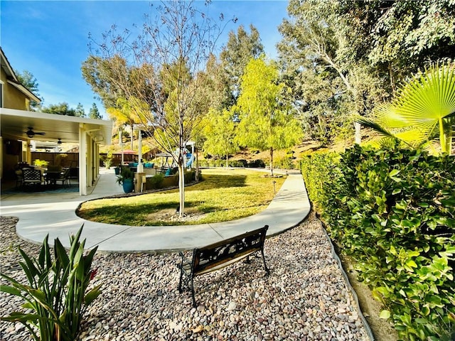 view of home's community featuring a lawn