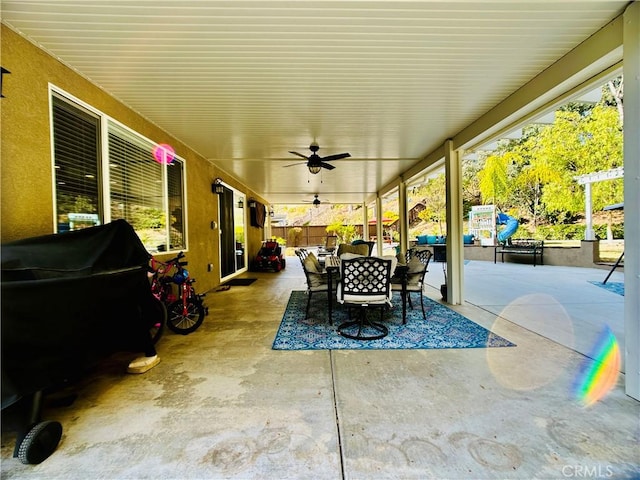 view of patio featuring a grill and ceiling fan