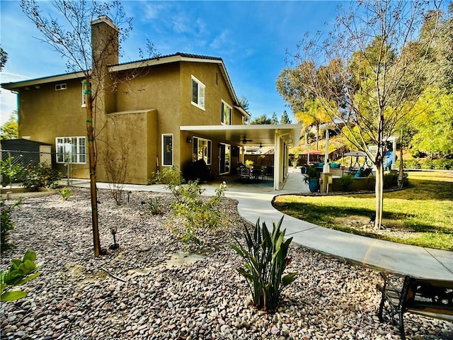 rear view of house with a lawn