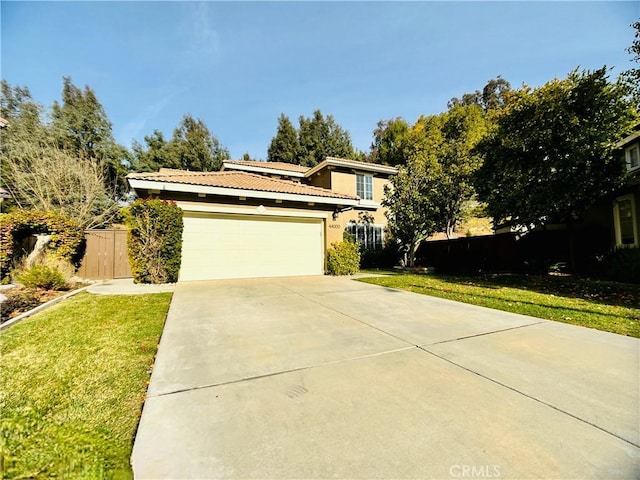 view of front facade featuring a garage and a front lawn