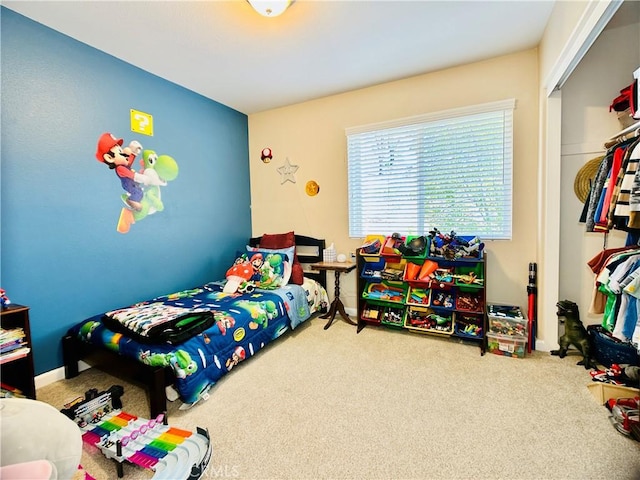 bedroom with carpet and a closet