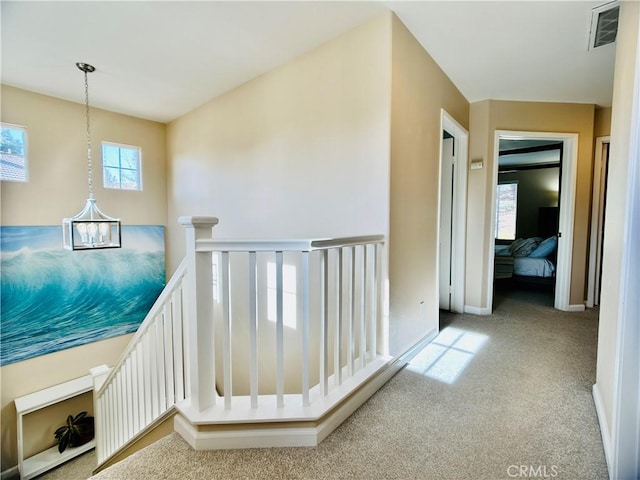 hallway with carpet floors