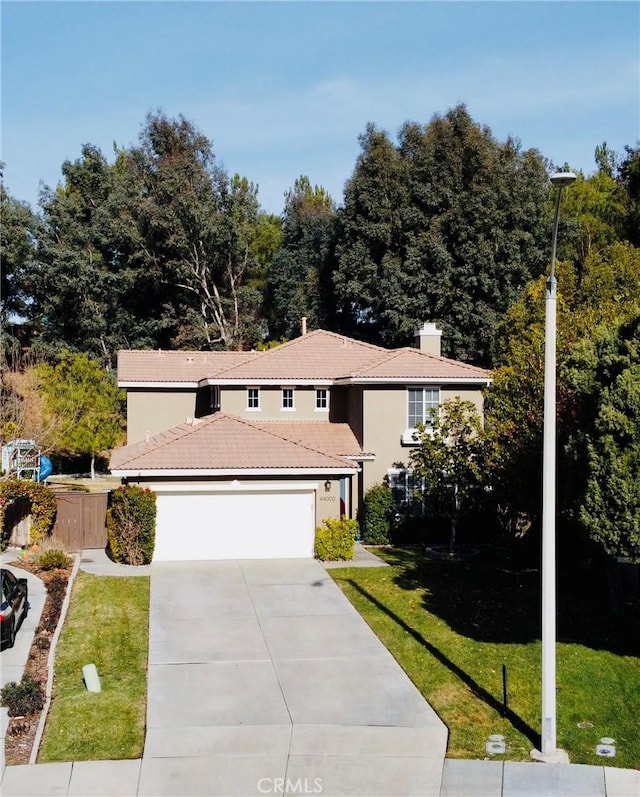 view of front facade featuring a garage and a front yard