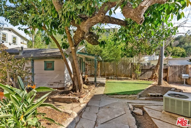 view of yard with a patio and cooling unit