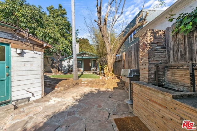 view of patio with an outdoor structure