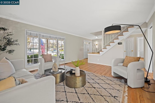 living room featuring ornamental molding and hardwood / wood-style flooring