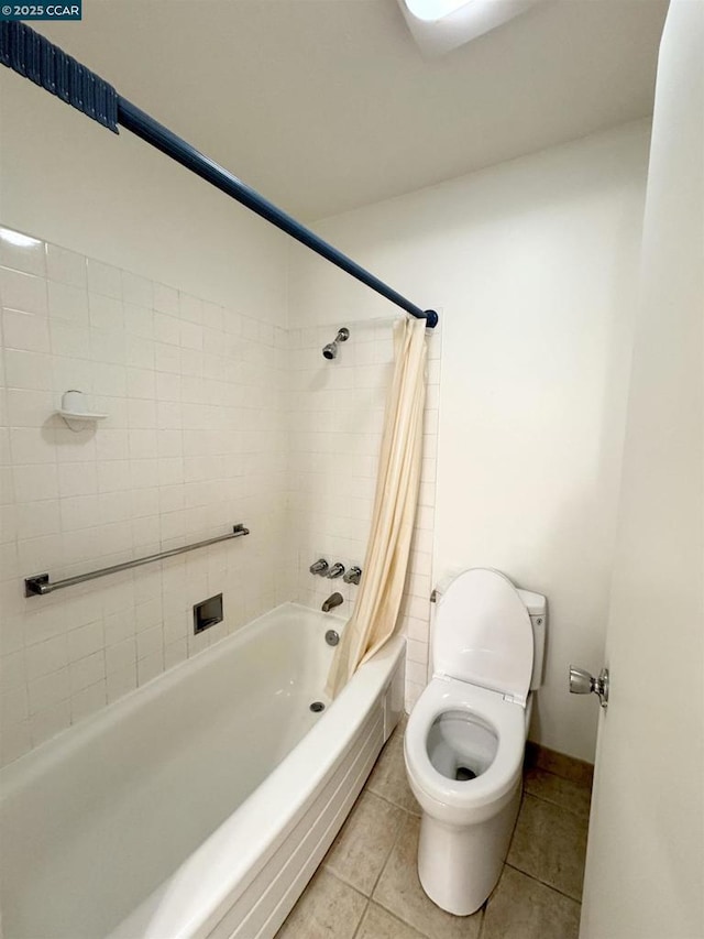 bathroom featuring toilet, tile patterned flooring, and shower / tub combo with curtain