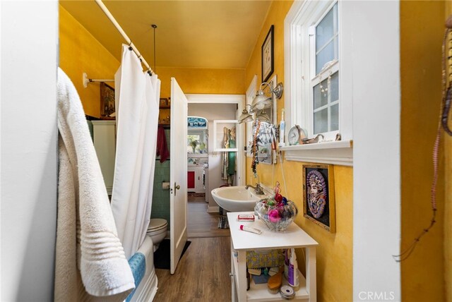 corridor featuring sink and dark hardwood / wood-style flooring