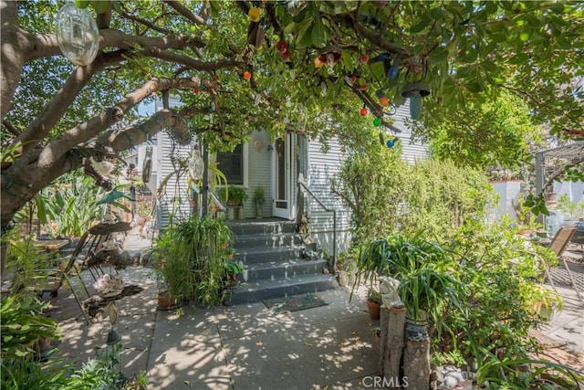 view of property exterior with a patio area