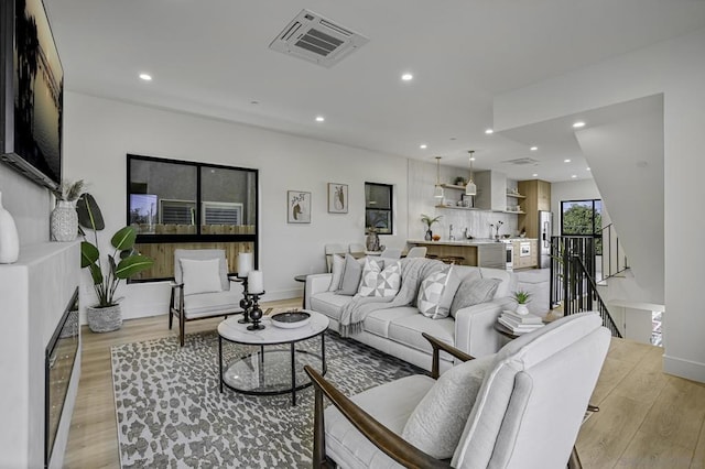 living room with light hardwood / wood-style flooring