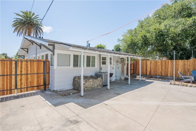 view of front of home featuring a patio area and central AC unit