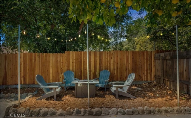 view of patio featuring an outdoor fire pit