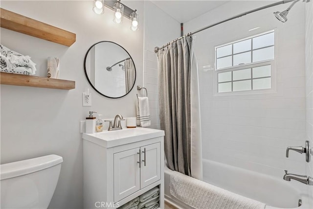 full bathroom with vanity, toilet, and shower / tub combo with curtain