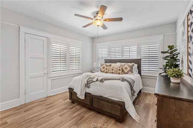 bedroom with light hardwood / wood-style flooring and ceiling fan