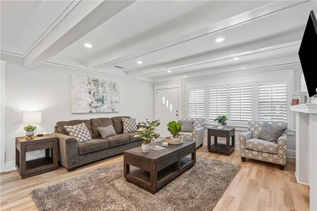 living room with light hardwood / wood-style flooring and beamed ceiling