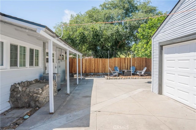 view of patio featuring a garage