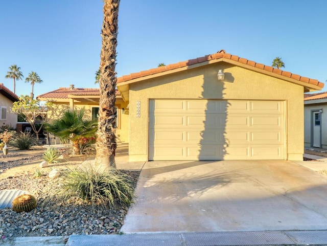 mediterranean / spanish-style home featuring a garage