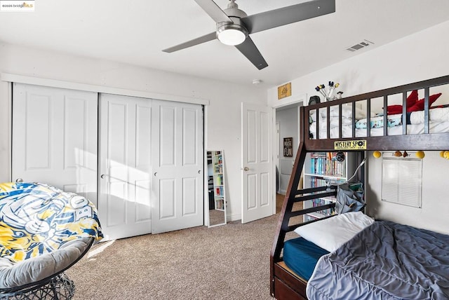 bedroom with ceiling fan, a closet, and carpet