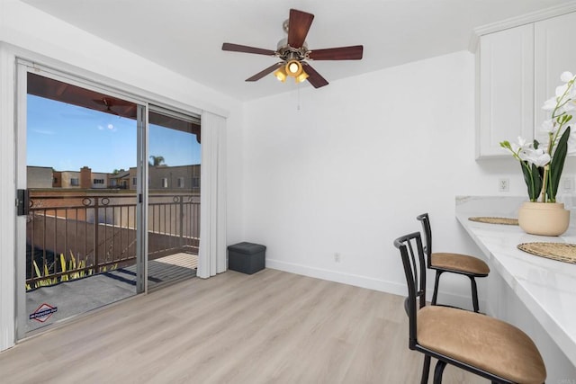 dining space featuring light hardwood / wood-style floors and ceiling fan