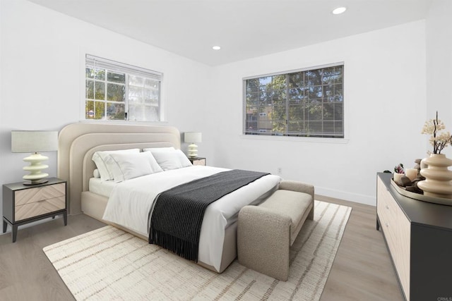 bedroom with light hardwood / wood-style floors