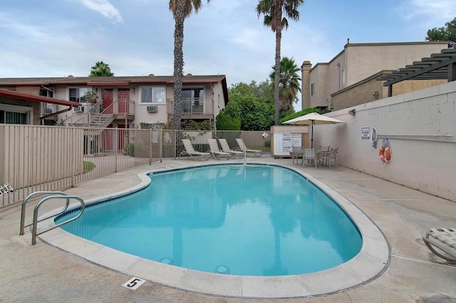 view of swimming pool with a patio area