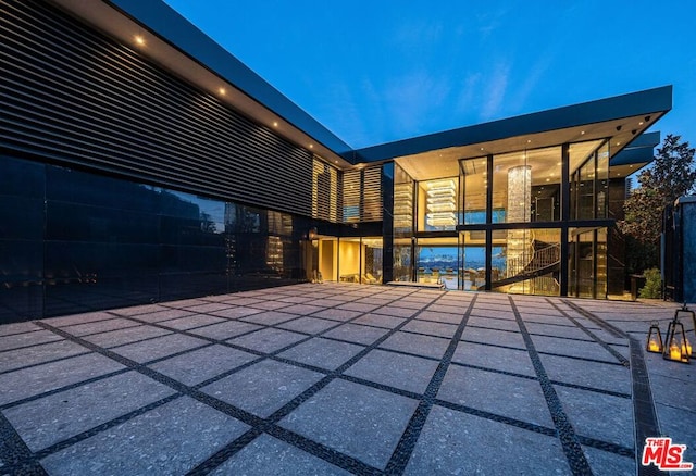 view of patio at twilight