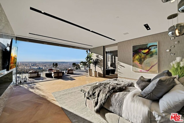 bedroom featuring parquet floors and expansive windows