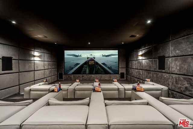 home theater with tile walls