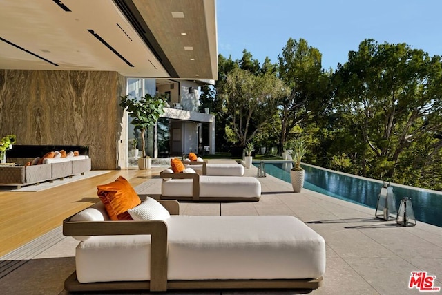 view of pool with an outdoor hangout area