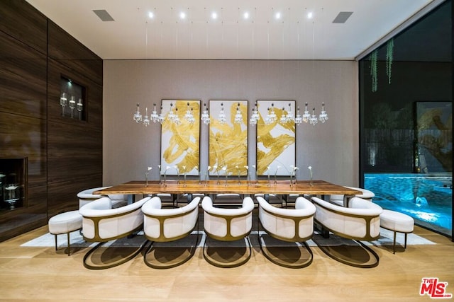 bar featuring light hardwood / wood-style floors and wooden counters