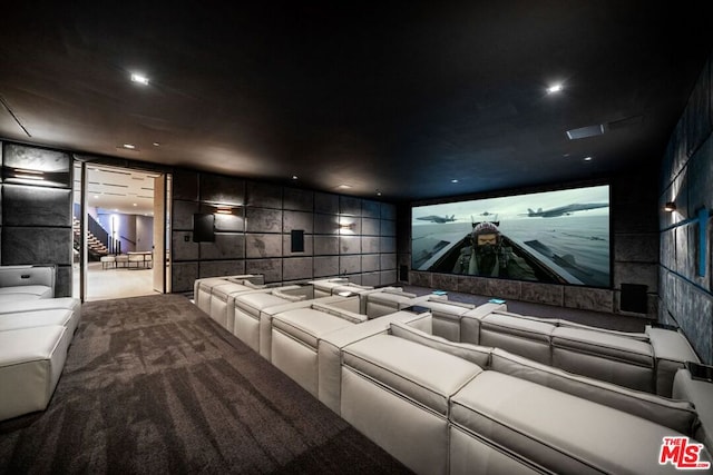 carpeted home theater with tile walls