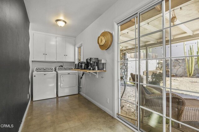 laundry room with cabinets and independent washer and dryer