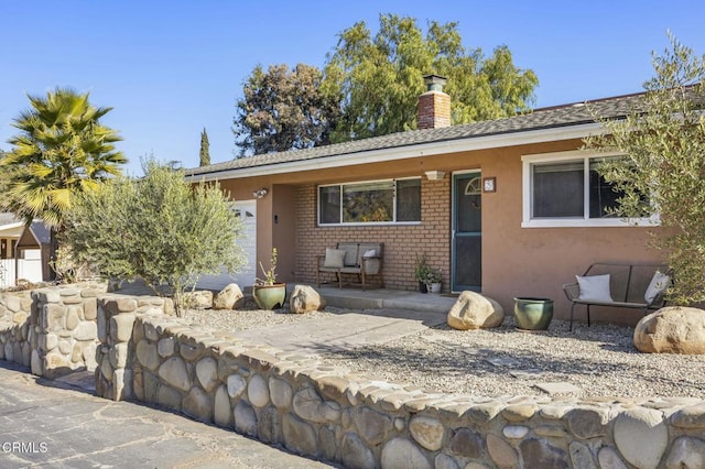 single story home featuring a garage