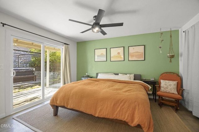 bedroom featuring ceiling fan and access to outside