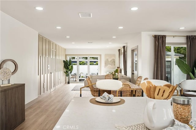 dining room with light hardwood / wood-style flooring