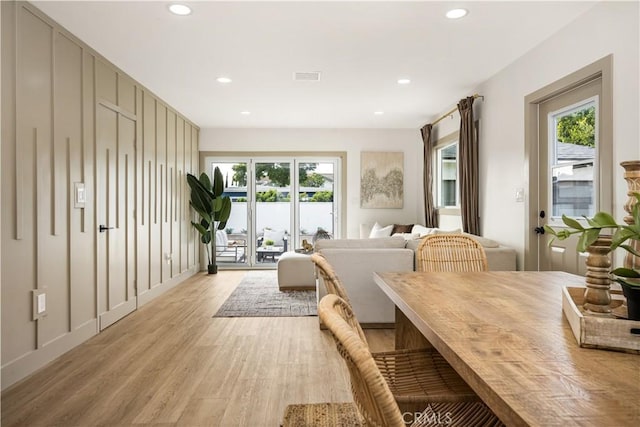 dining area featuring light hardwood / wood-style floors and a wealth of natural light