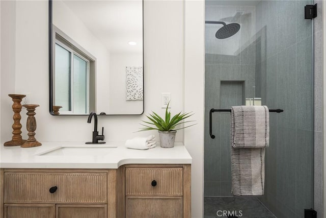 full bath featuring a shower stall and vanity