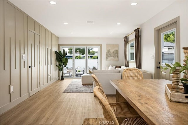 dining space with recessed lighting, plenty of natural light, visible vents, and light wood-style floors