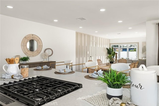 kitchen featuring visible vents, stovetop, and recessed lighting