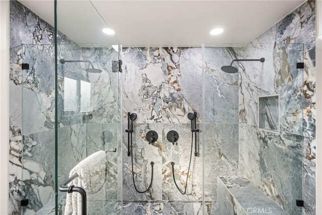 interior details with a marble finish shower and recessed lighting