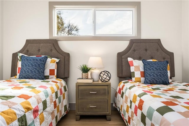 bedroom with wood finished floors