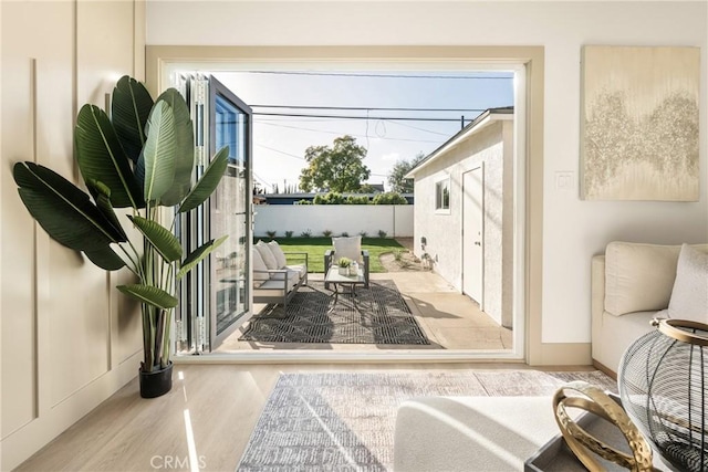 doorway to outside with wood finished floors