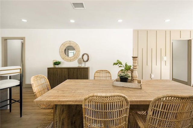 dining space featuring recessed lighting, visible vents, and wood finished floors