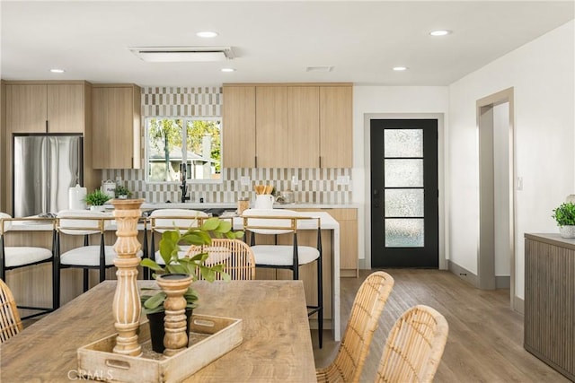 interior space with light wood-style floors, baseboards, and recessed lighting