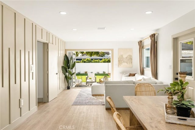 sitting room with recessed lighting, visible vents, and light wood-style floors