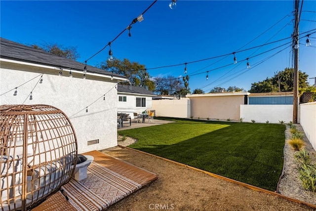 view of yard with a fenced backyard and a patio