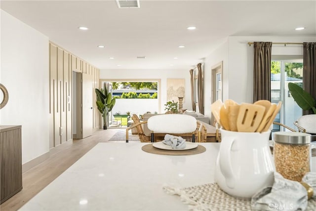 sitting room featuring recessed lighting, visible vents, and light wood-style flooring