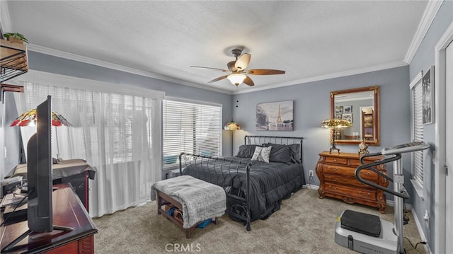 bedroom with ceiling fan, light colored carpet, a textured ceiling, and crown molding